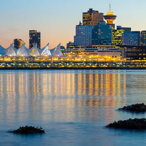 Study in Australia - Modern city skyline reflected in harbor waters