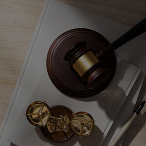 Judge’s gavel and scales of justice placed on legal documents