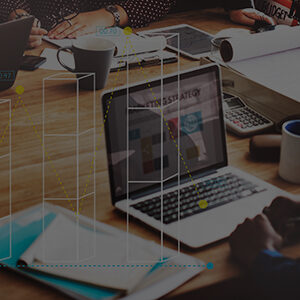 Business and management team discussing strategy with laptops and financial charts