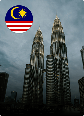 Petronas Twin Towers with Malaysia flag icon representing study in Malaysia.